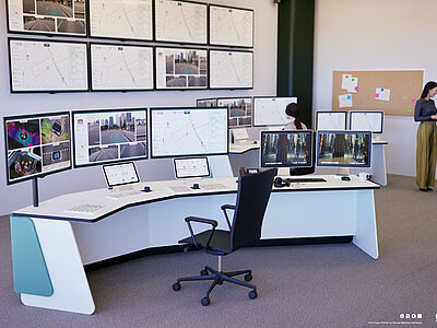 Ein Raum mit Schreibtisch und vielen Monitoren